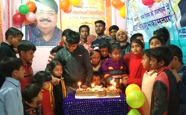 People celebrated birthday of parimal Nathwani by cutting cake and distributing sweets.