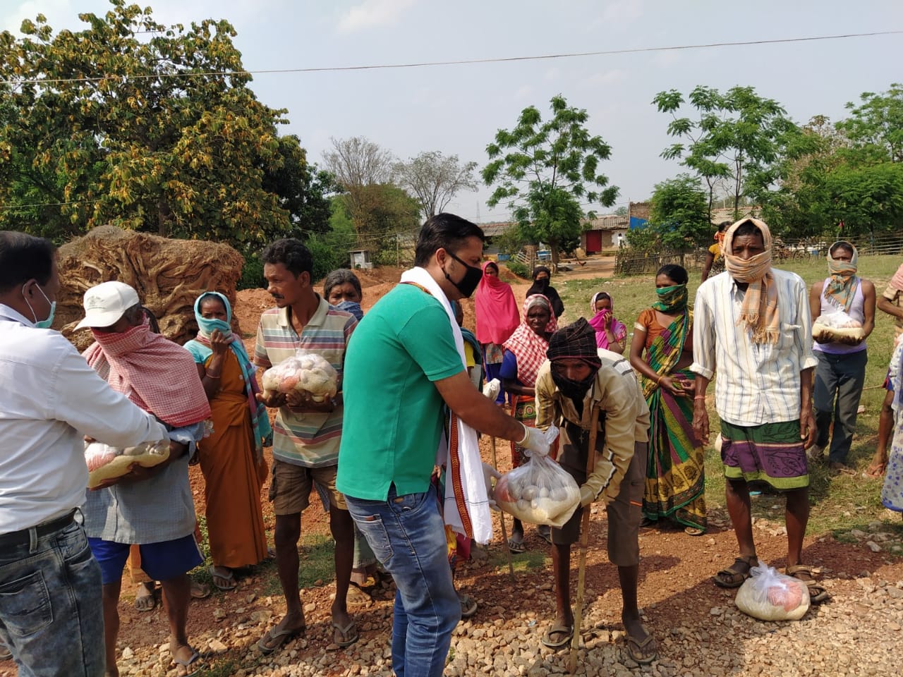 Distribution by lions club of ranchi capital in kurgi village.