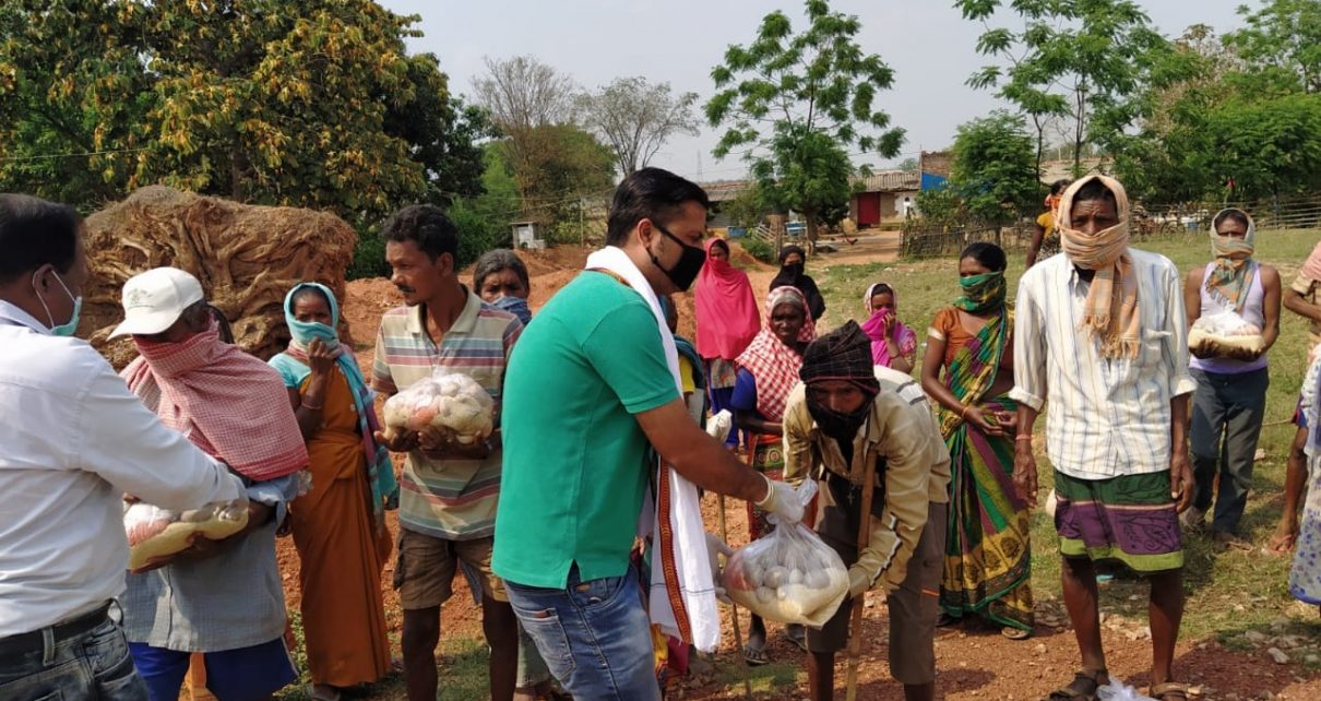 Distribution by lions club of ranchi capital in kurgi village.